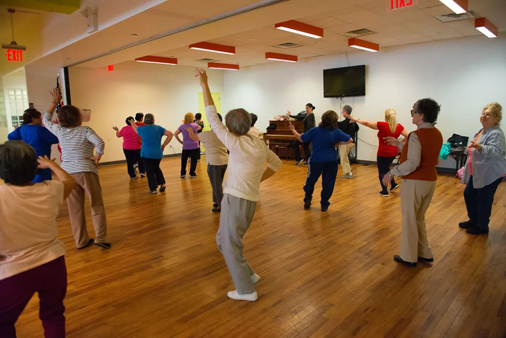 The Older Adult Center at SCS provides a warm meal and fun for older people