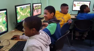 Students enjoying the Computer Lab at the SCS Cornerstone Program at Woodside Houses
